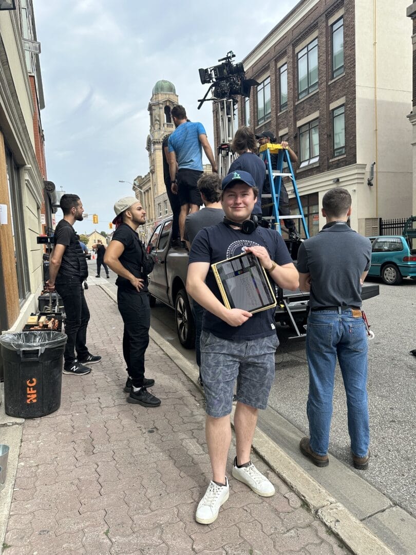 College for Arts and Technology Professional Filmmaking Graduate Michael Marentette poses on a film set.  