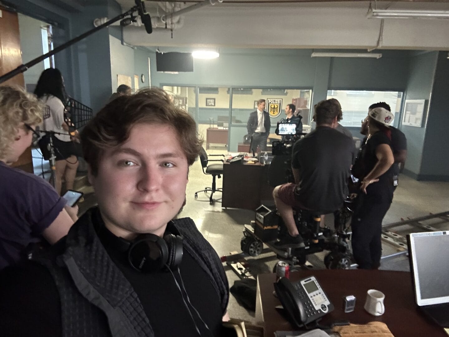 College for Arts and Technology Professional Filmmaking Graduate Michael Marentette poses on a film set. 